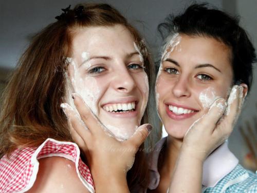 two young women applying sunscreen on their faces at Agriturismo Sanguineto in Acquaviva