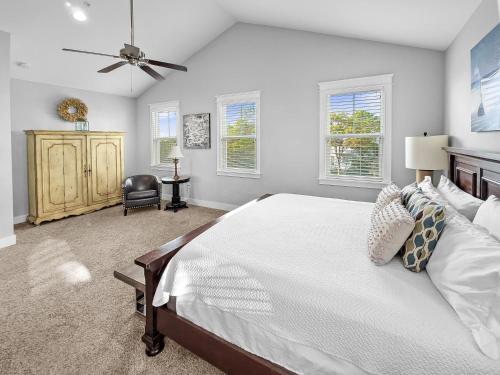 a bedroom with a bed and a ceiling fan at Floridays Home in Blue Mountain Beach