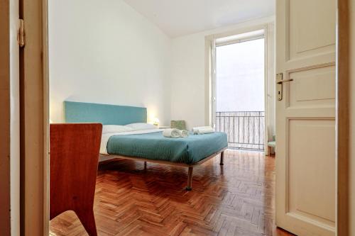 A bed or beds in a room at Teatro Massimo Lovely Flat with Balconies