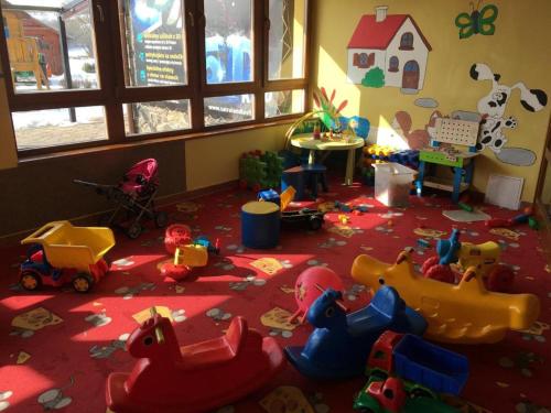 a room filled with toys on the floor at Tatralandia Apartmán in Liptovský Mikuláš