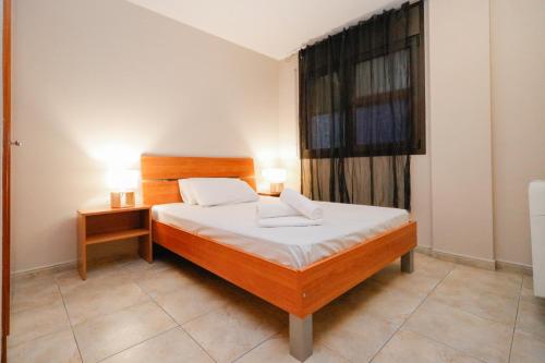 a small bedroom with a bed and a window at Apartamentos Degas MIKKA in El Tarter