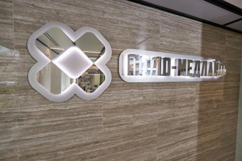 two mirrors on the wall of a building at Спа-готель ПОЛО-МЕДЛАЙФ in Kremenchuk