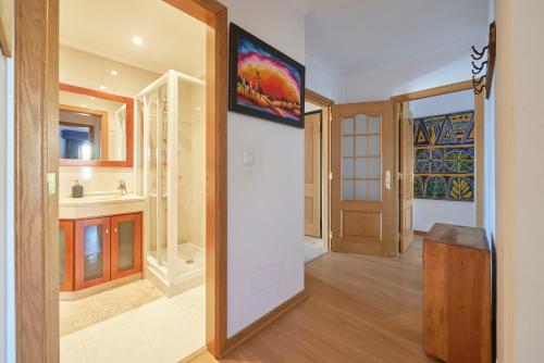 a hallway of a home with a door and a room at Apartamento junto NOVA&PRAIA Carcavelos II in Carcavelos