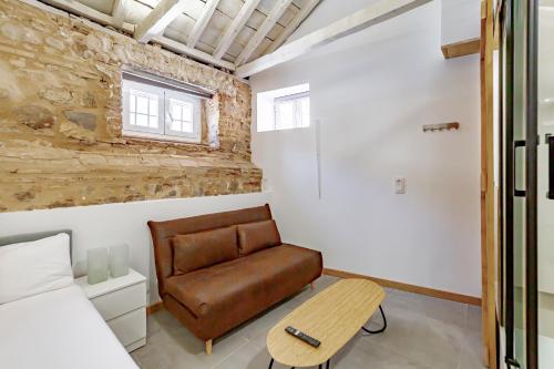 a living room with a couch and a table at Trinitarios Apartment in Toledo