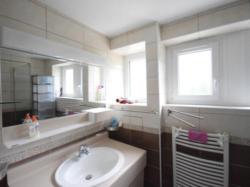 a bathroom with a sink and a mirror at Appartement à Évian-les-Bains avec wifi, garage fermé et animaux admis - FR-1-498-40 in Évian-les-Bains