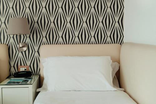 Cama o camas de una habitación en Mini Hotel - Angolo Di Paradiso -