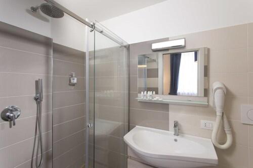 a bathroom with a shower and a toilet and a sink at Hotel Vista di Capri in Massa Lubrense