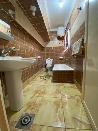 a bathroom with a sink and a toilet at Al Crown in Sharm El Sheikh