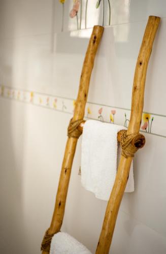 two wooden racks in a bathroom with a towel at La Villa 126 Dakar in Dakar
