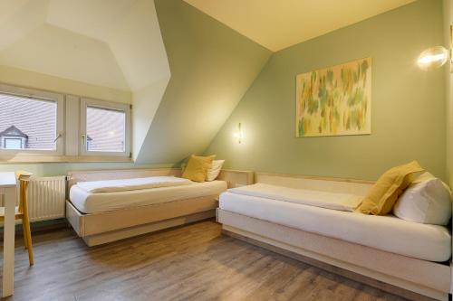 Cama o camas de una habitación en Hotel Kunterbunt in Würzburger Innenstadt