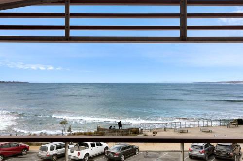 a view of the ocean from a balcony of a beach at Rip n View in Point Lonsdale