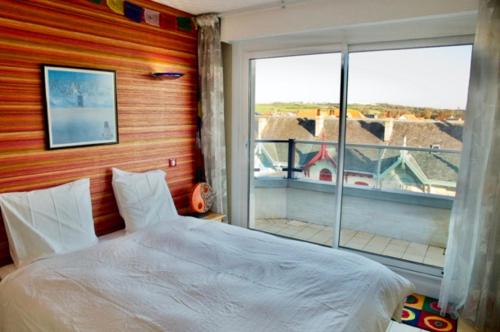 En eller flere senge i et værelse på La terrasse du grand bleu à Wimereux