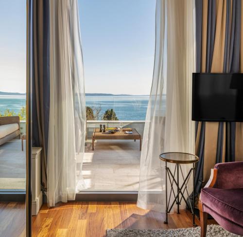 a room with a view of a living room at Hotel Park Split in Split