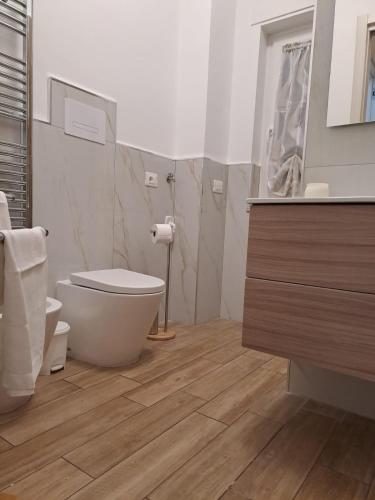 a bathroom with a toilet and a sink at La Fenice in Agropoli