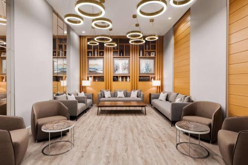 a waiting room with couches and tables at Tbilisi Chambers, Trademark Collection by Wyndham in Tbilisi City
