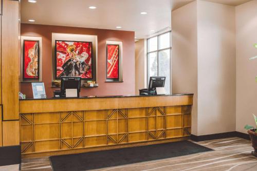 a lobby of a hotel with a reception desk at Wyndham Chicago McCormick in Chicago