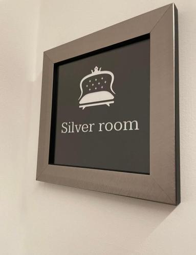 a framed picture of a silver room on a wall at GL rooms and apartments in Bari