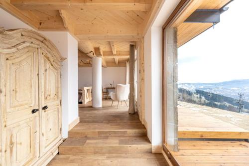 a hallway of a house with a door and a table at Dom Tatrzański Ewa Deluxe in Kościelisko