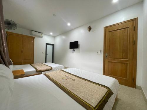 Giường trong phòng chung tại Thu Thủy Cruise - Travel
