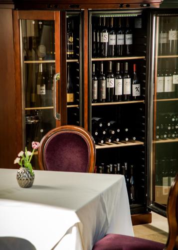 a table in a room with a bunch of wine bottles at Hotel Park Split in Split