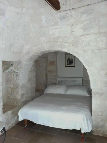 Llit o llits en una habitació de Fontana Vecchia B&B