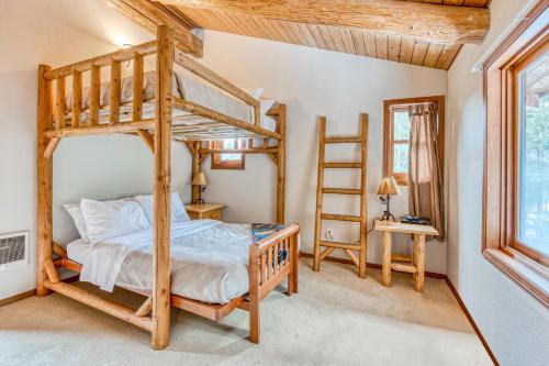 a bedroom with a bunk bed and a ladder at Sandy River Relaxation in Rhododendron