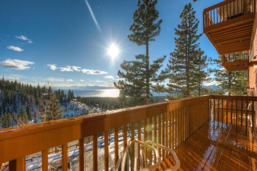 a balcony with a view of the snow covered trees at Fairview in Incline Village