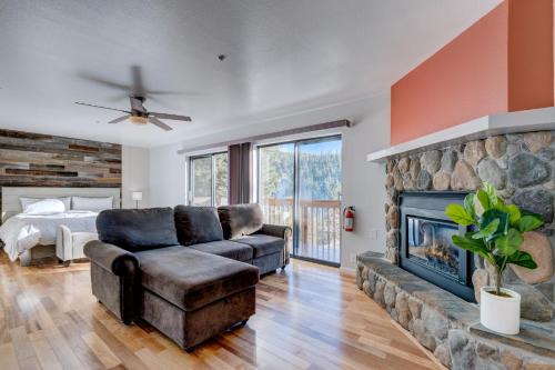 a living room with a couch and a fireplace at Fairview in Incline Village