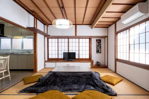 a large room with a table in the middle of it at Bell-Rental Villa Engawa House in Fujikawaguchiko