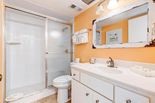 a bathroom with a shower and a toilet and a sink at Van Lee 1003 in Ormond Beach