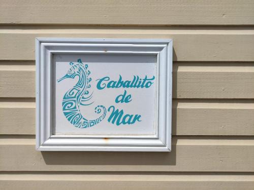 a sign on the side of a building at Santuarios del Mar in Bocas del Toro