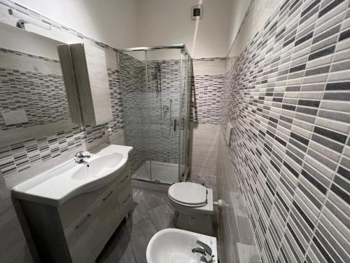 a bathroom with a sink and a toilet and a shower at VillaRussoRoma in Rome