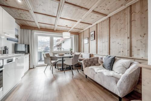 a living room with a couch and a table at Soelden Lounge in Sölden