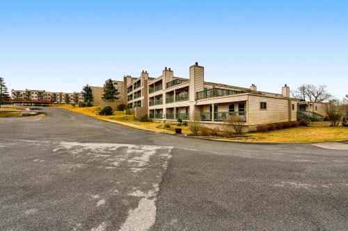 an empty street in front of a building at Serene Green Sanctuary in Beech Mountain