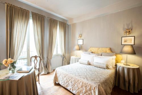 a bedroom with a bed and two tables with lamps at Giò&Giò Venice B&B in Venice