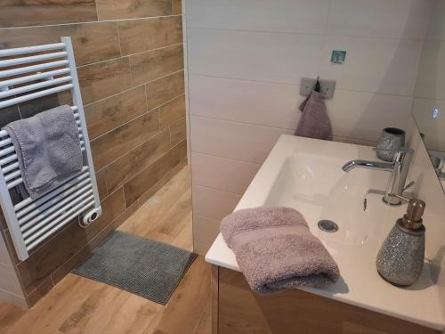 a bathroom with a sink and a bath tub at Domaine de Pacciolello - Porticcio in Porticcio