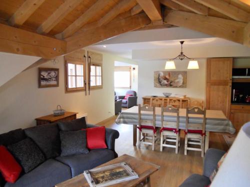 a living room with a couch and a dining room at Appartement Valloire, 4 pièces, 8 personnes - FR-1-263-199 in Valloire