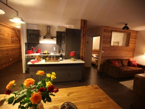 a kitchen and living room with a couch and a table at Appartement Valloire, 4 pièces, 8 personnes - FR-1-263-209 in Valloire