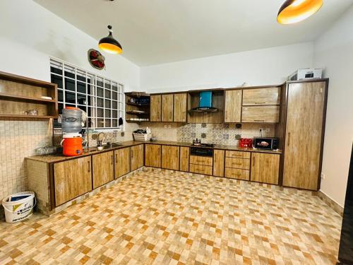 A kitchen or kitchenette at Islamabad Travelodge Guest House