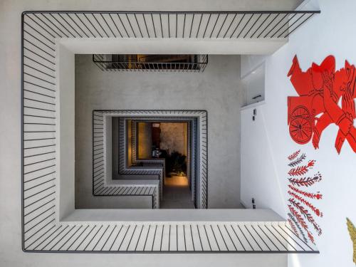 a view of a hallway with a mirror on the wall at The Newel Psychiko in Athens