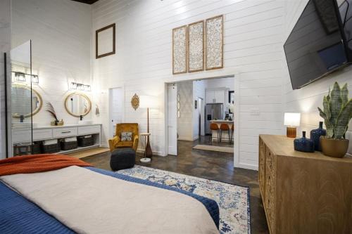 a bedroom with a king sized bed and a bathroom at Moroccan Nights in Broken Bow