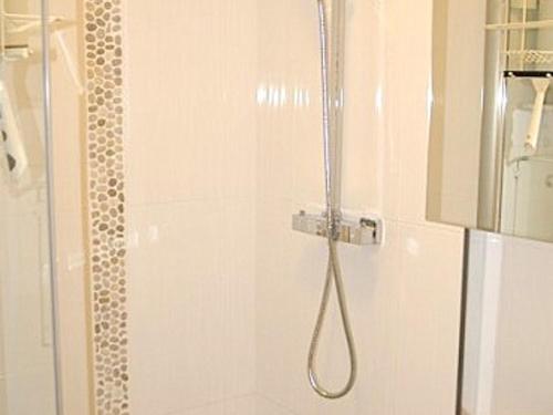 a shower in a bathroom with a glass door at Studio chaleureux aux Adrets - Face aux pistes, 4ème étage, 2 pers, cuisine équipée - FR-1-557-28 in Les Adrets