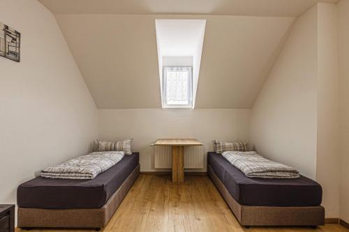 Ein Bett oder Betten in einem Zimmer der Unterkunft Moderne Monteurwohnung in Leipzig Nord