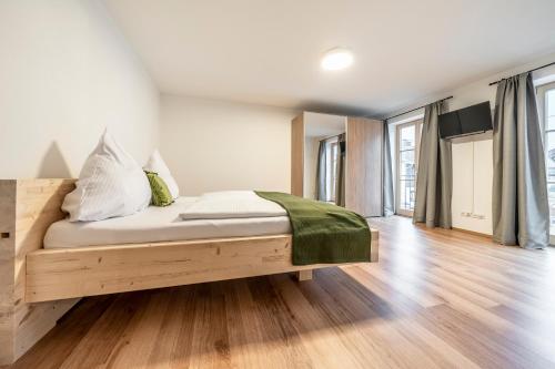 Кровать или кровати в номере Alpenrose Ferienwohnungen