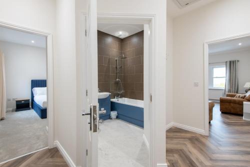a bathroom with a tub and a shower in a room at The Sidings in Durham