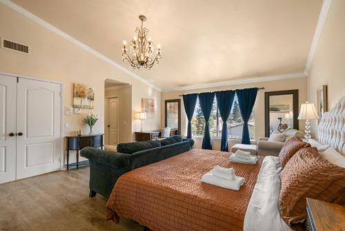 a large bedroom with a bed and a couch at @ Marbella Lane - Captivating Home in Rowland Hts in Rowland Heights