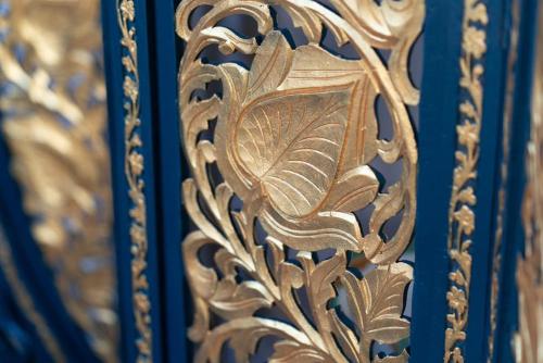 a gold bench with a leaf design on it at Beachfront Luxury Home with Spectacular Sea Views in Herne Bay