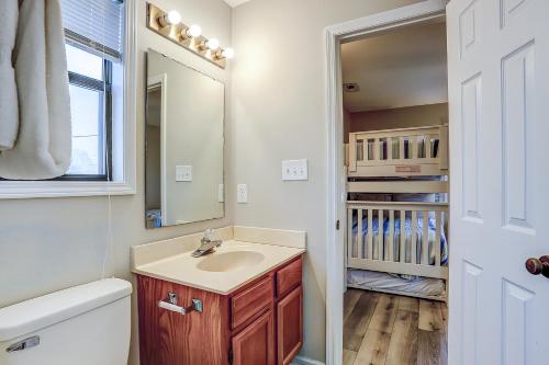 a bathroom with a sink and a toilet and a mirror at Blue Heron in Myrtle Beach