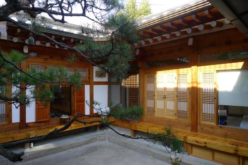 an entrance to a japanese house with a wooden facade at Renewal Open!!! Entire Place, Traditional Stay Xiwoo , 時雨 시우 한옥독채 in Seoul