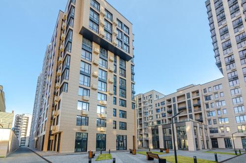 an apartment building in a city with tall buildings at 3131Designer apartments in the residential complex "Yaroslaviv Grad" in Kyiv